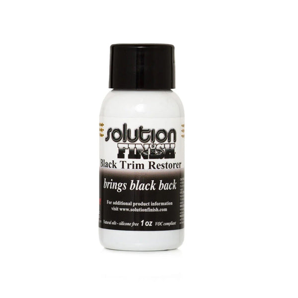 A bottle of Solution Finish Black Trim Restorer on a white background.