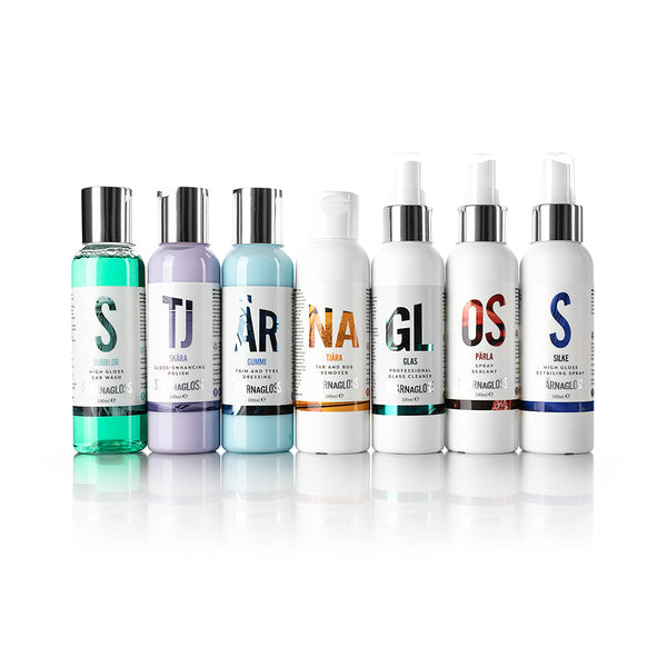 The contents of the Stjarnagloss - Essential Gift Box. From left to right: Bubblor high gloss car wash - 100ml, Skära gloss-enhancing polish - 100ml, Gummi trim and tyre dressing - 100ml, Tjära tar and bug remover - 100ml, Glas professional glass cleaner - 100ml, Pärla spray sealant - 100ml, Silke high gloss detailing spray - 100ml