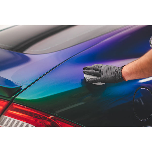 Using a Pearl Puck Applicator from The Rag Company in Ice Grey to apply coating to a Jaguar XKR with Purple, blue and green multi-tone pearlescent paint. These pearl weave microfiber applicators have a no-soak barriers inside them that prevents precious coating products from seeping into the sponge.