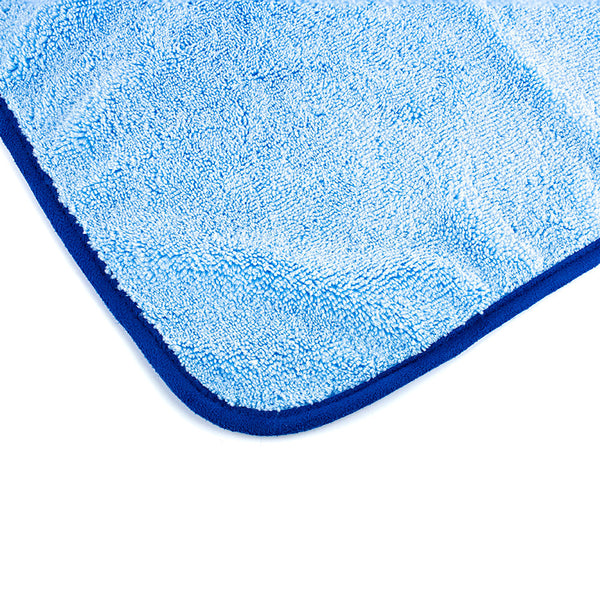 The corner of the Blue Collar towel on a white background.