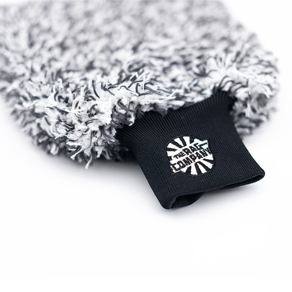 The Cyclone Ultra Wash Mitt from The Rag Company. It has a black and white twist loop microfiber with a patented microfiber liner, and a long cuff with the TRC logo