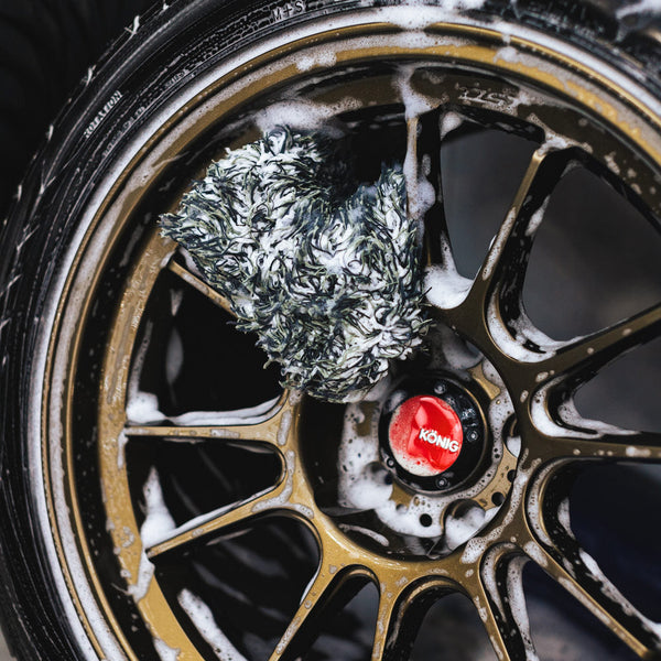 Wheel Mitt being used to clean a tire wheel