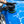 A person using the Koch Chemie Polish and Sealing pad on a blue car.