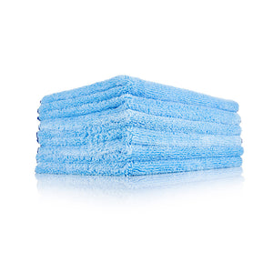 A stack of Blue Collar towels on a white background.