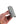 A hand holding the Wrap N' Tuck over a white background.